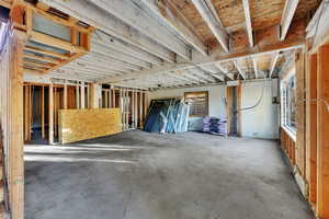 Misc room featuring unfinished concrete floors