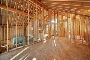 Miscellaneous room with lofted ceiling