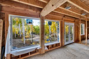 Unfurnished sunroom with french doors