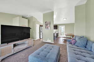 Living room featuring carpet and baseboards