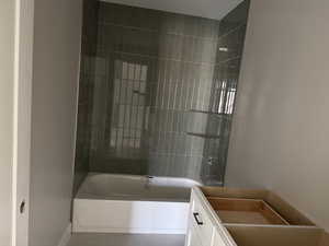 Full bath with shower / bathtub combination and tile patterned flooring