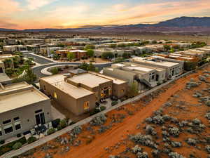 Aerial perspective of suburban area with a mountainous background