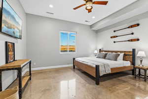 Bedroom with finished concrete flooring, ceiling fan, and recessed lighting