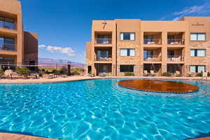Community pool with a mountain view