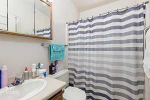 Full bath featuring vanity and a shower with curtain
