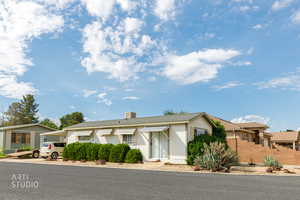 Ranch-style house featuring a carport