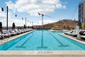 Community pool with a mountain view and a patio