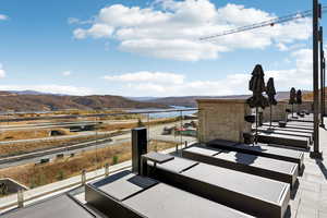Balcony with a water and mountain view