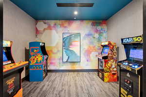 Game room featuring wallpapered walls