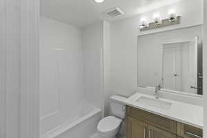 Bathroom with vanity and tub / shower combination