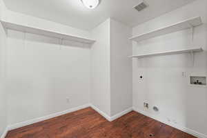 Electric & Gas Laundry Hookups in dedicated laundry room with shelves and storage space