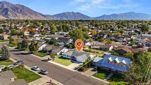 Aerial view of residential area featuring a mountainous background