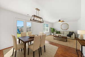 Dining space featuring ceiling fan and wood finished floors