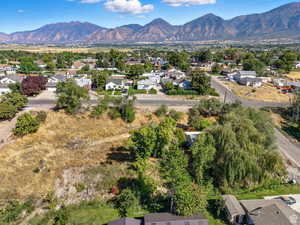 Aerial view of residential area featuring a mountainous background