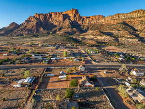 Aerial view of property's location featuring a mountain backdrop