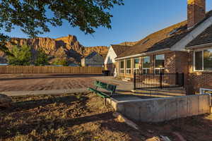Fenced yard with a patio and a mountain view