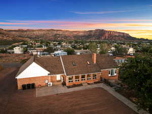 Aerial view at dusk of a residential view and a mountain view