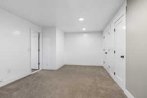 Unfurnished room featuring light colored carpet and recessed lighting