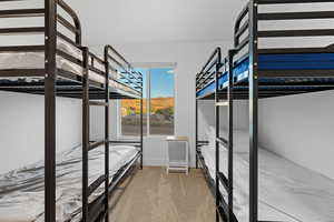 Unfurnished bedroom with light colored carpet