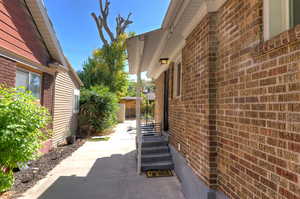 View of side of property featuring brick siding
