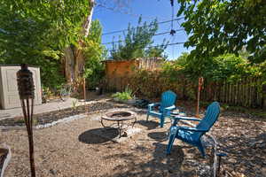 View of yard with a patio area and an outdoor fire pit