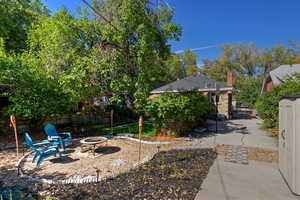 View of yard featuring a patio area and a fire pit