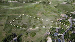 Aerial overview of property's location with property parcel outlined