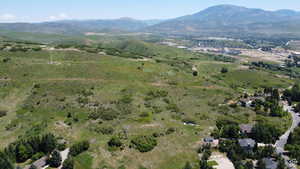 Aerial overview of property's location with a mountain backdrop