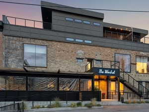 View of property featuring stairs