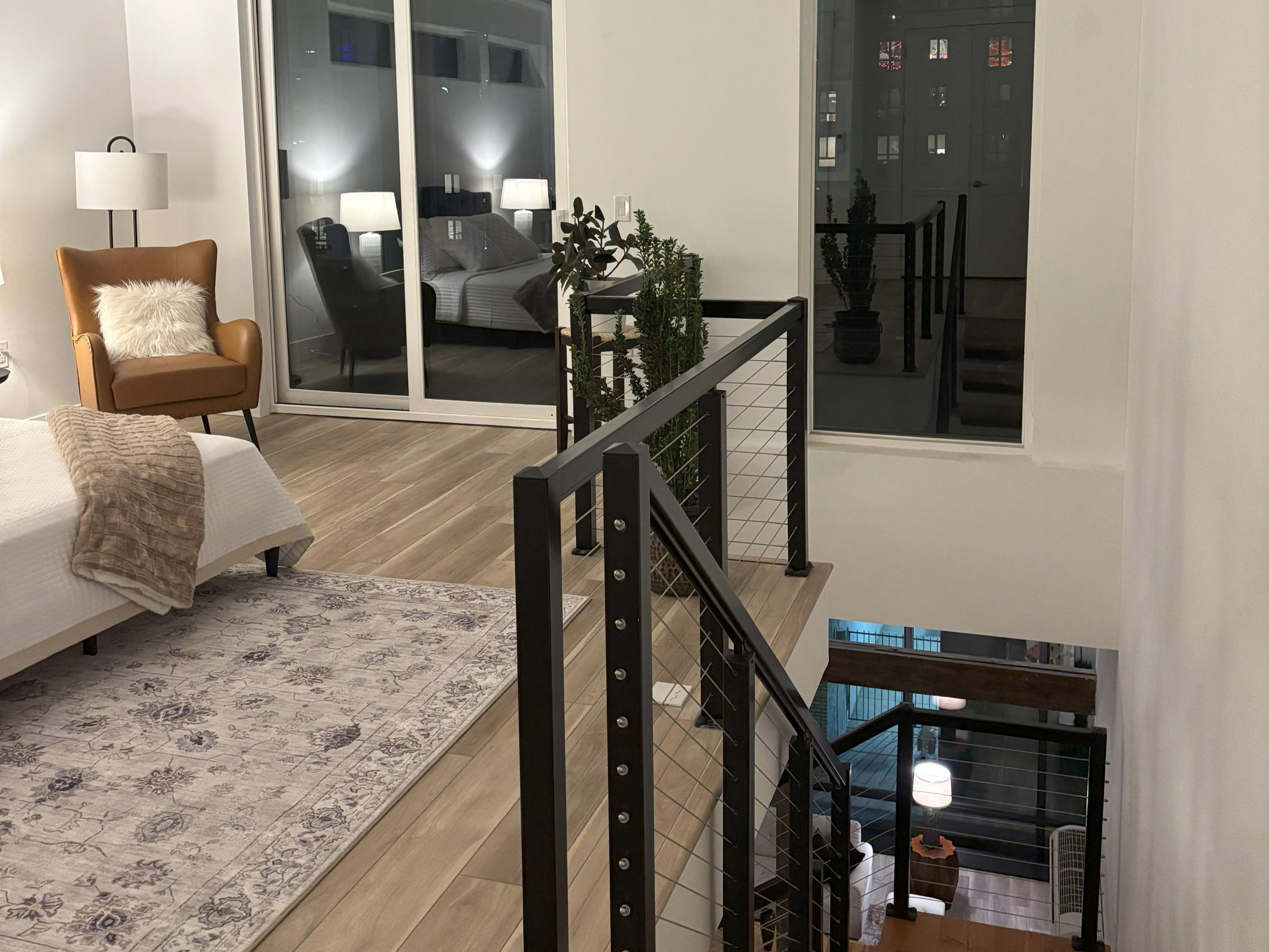 Stairway with wood finished floors and recessed lighting