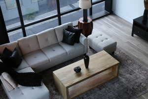 Living area featuring light wood-style flooring and baseboards
