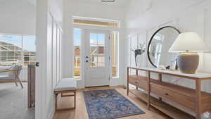 Entrance foyer with light wood finished floors