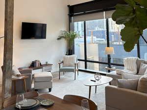 Living room with recessed lighting and wood finished floors