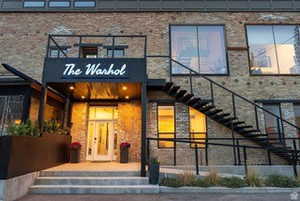 Property entrance featuring stone siding