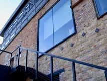 View of side of property with brick siding