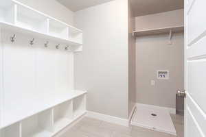 Mudroom featuring baseboards