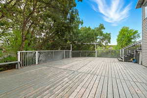 Deck featuring view of scattered trees