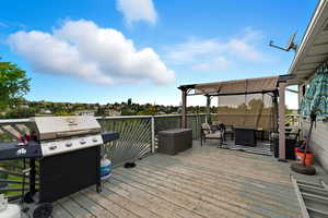 Deck with area for grilling and an outdoor hangout area