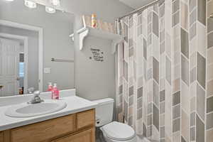 Full bathroom featuring vanity and toilet