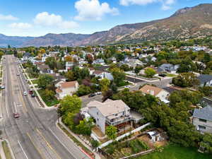 View of property location featuring mountains and nearby suburban area