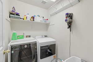 Laundry area featuring independent washer and dryer