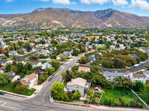 View of property location featuring mountains and nearby suburban area