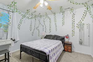 Bedroom featuring light carpet and a ceiling fan