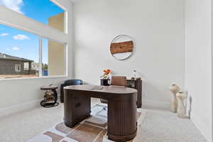 Office space featuring light colored carpet