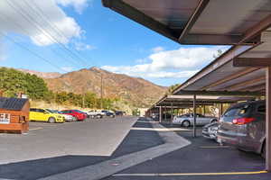 Partially covered parking lot with a mountain view