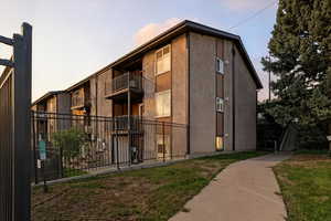 View of property at dusk