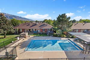 Community pool with a patio