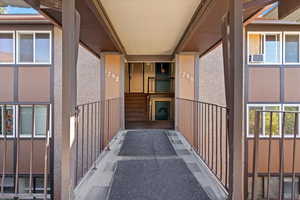 Entrance to property featuring stucco siding