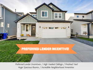 Craftsman-style home featuring stone siding, board and batten siding, concrete driveway, and a garage