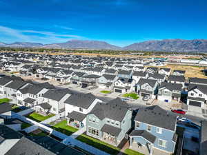Aerial view of residential area featuring a mountainous background